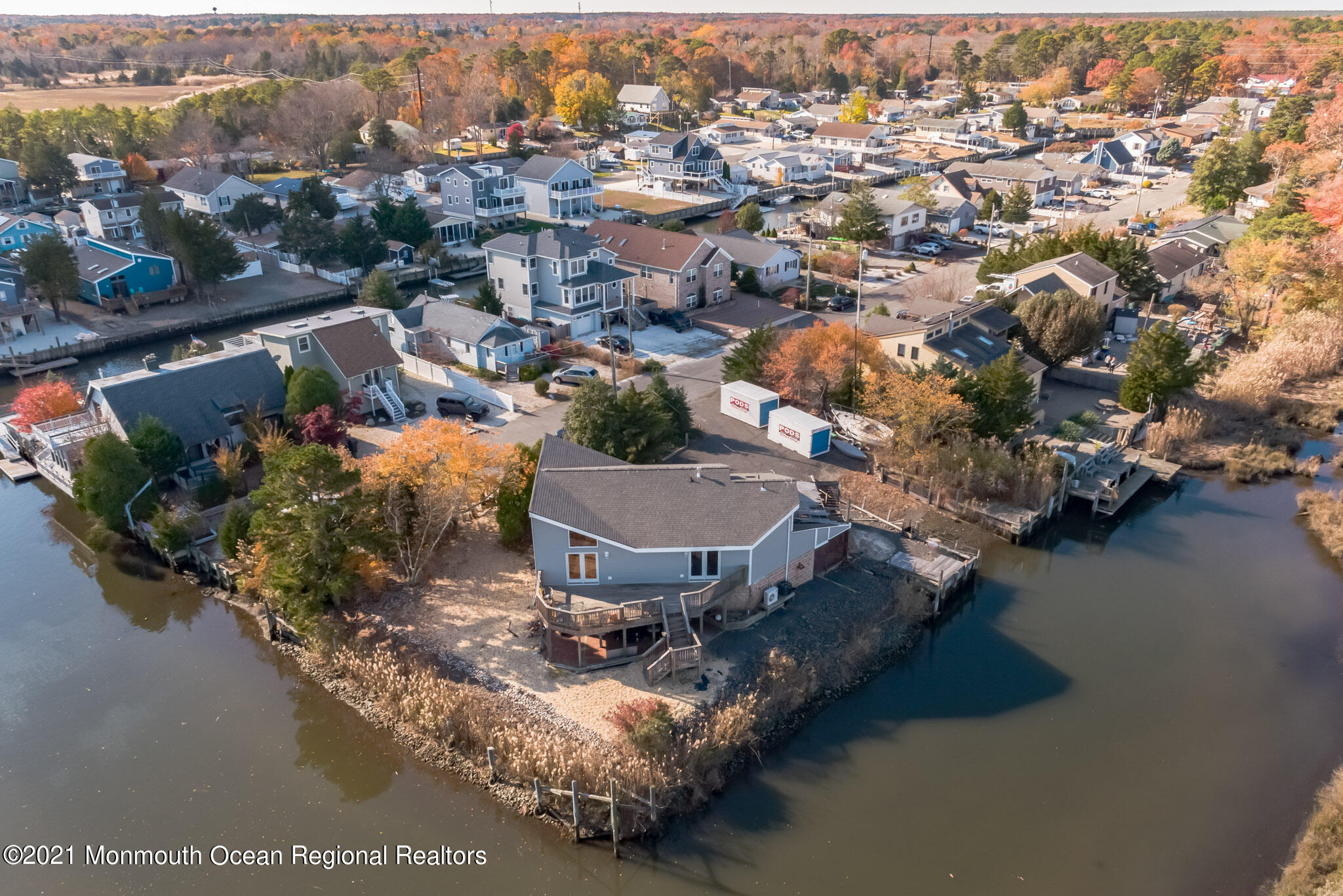 97 Edgewater Drive Tuckerton, NJ 08087 - Photo 33 of 41 an aerial view of a house with a garden and lake view
