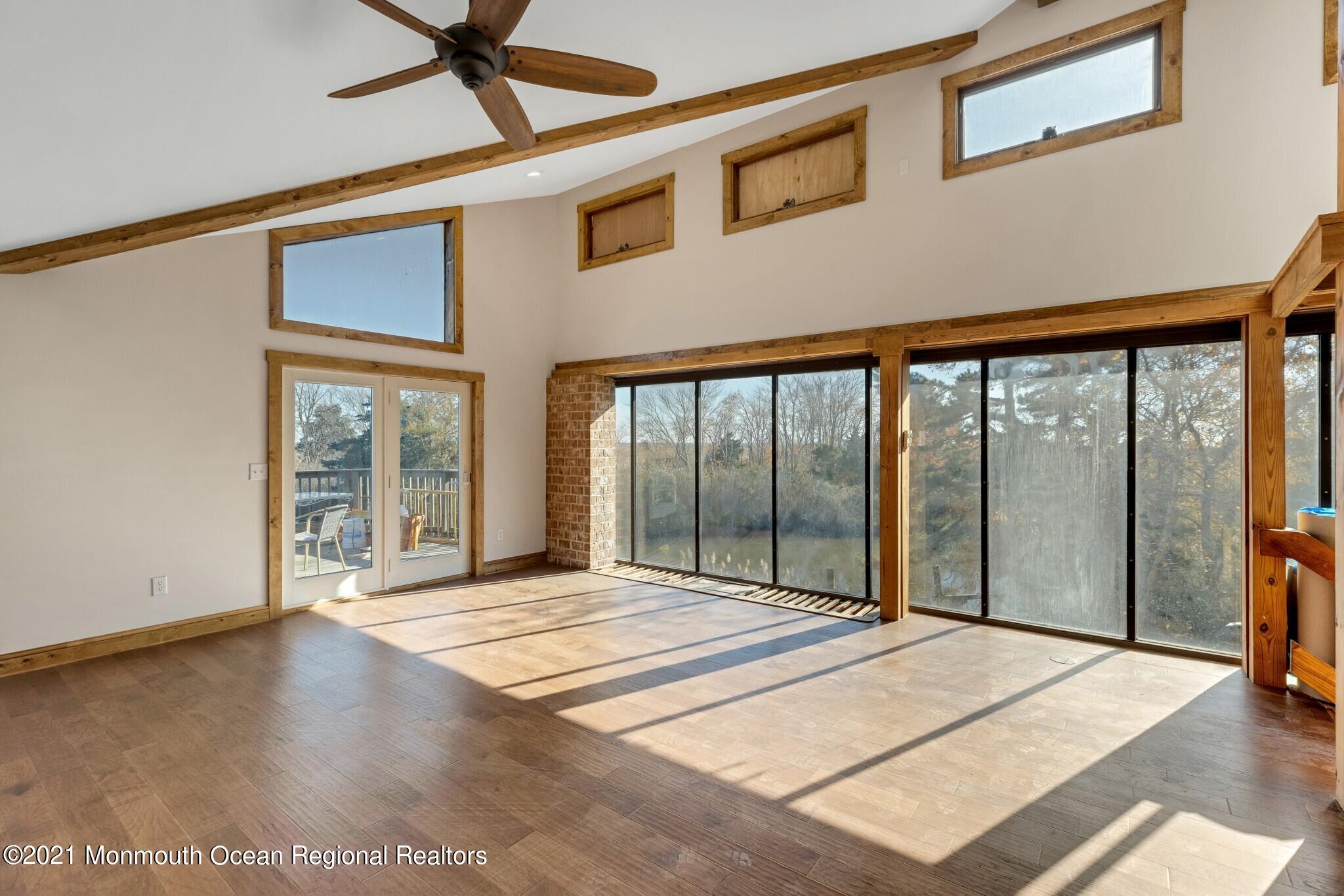 97 Edgewater Drive Tuckerton, NJ 08087 - Photo 7 of 41 a bedroom with a bed and a large window