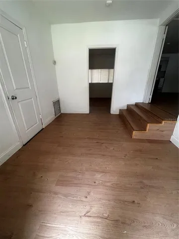 a view of an empty room and entryway