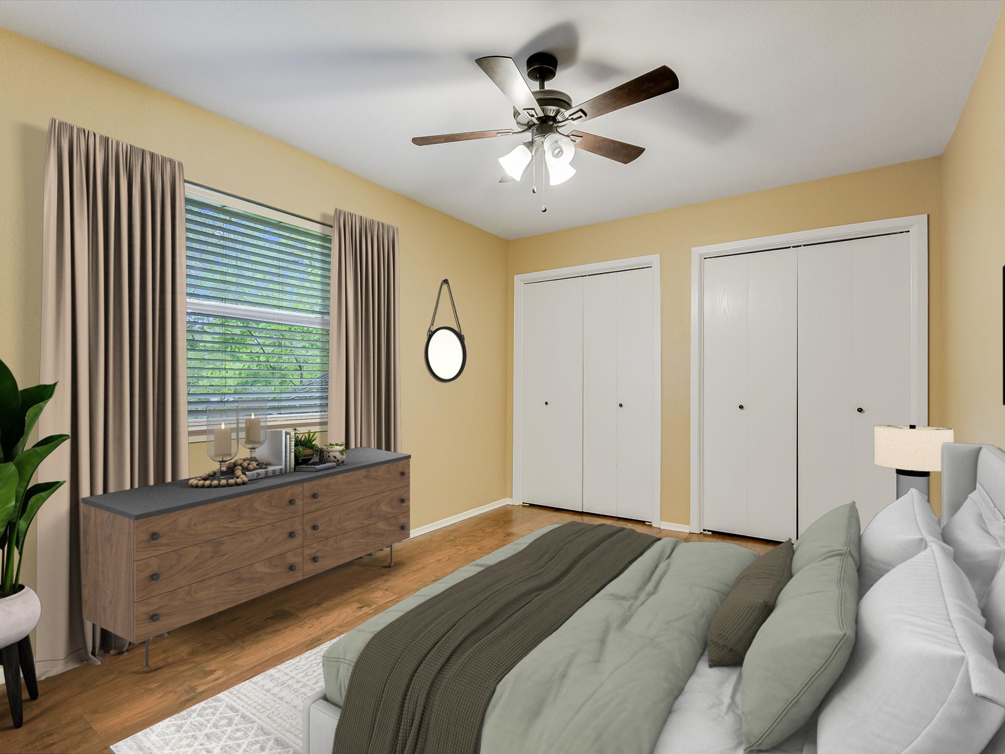 1704 Waterloo Trail, Unit B Austin, TX 78704 - Photo 9 of 10 Bedroom with two closets, wood finished floors, and ceiling fan