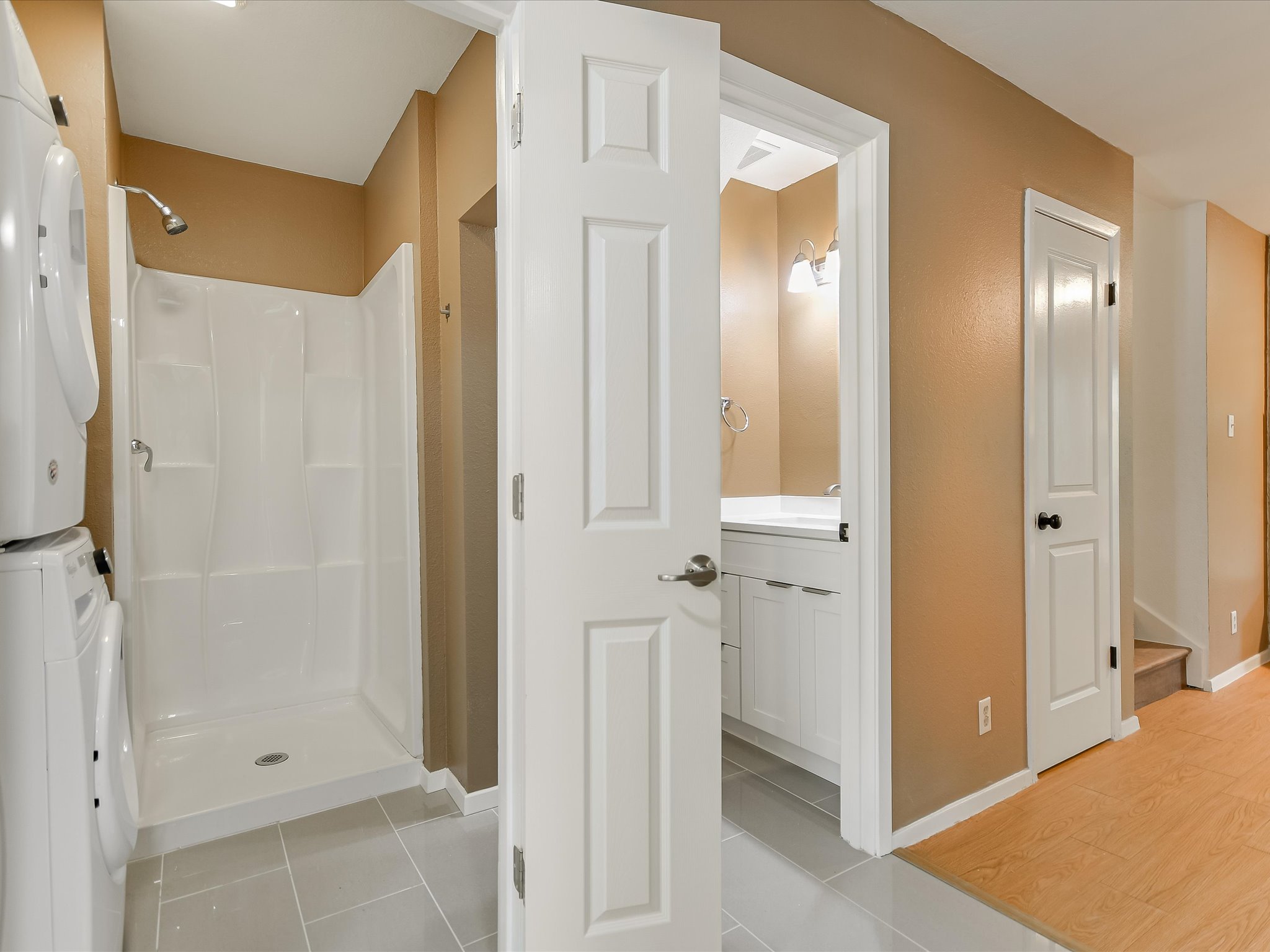 1704 Waterloo Trail, Unit B Austin, TX 78704 - Photo 10 of 10 Full bathroom with vanity, a stall shower, stacked washer and clothes dryer, and light tile patterned floors