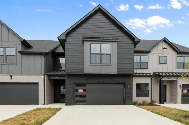 a front view of a house with a garage
