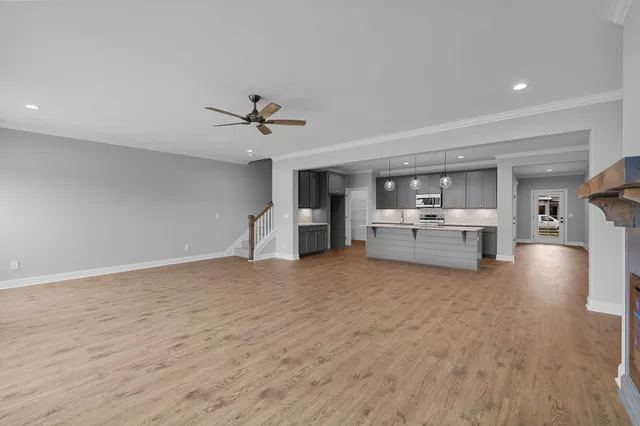 a view of kitchen with furniture and wooden floor