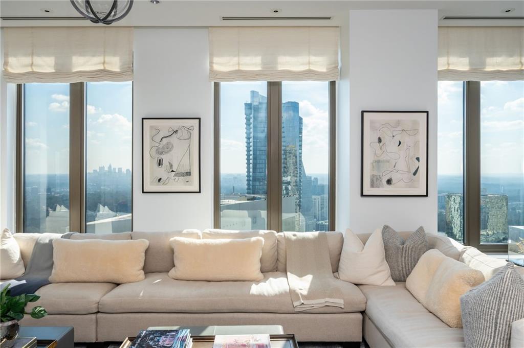 3376 Peachtree Road Northeast, Unit PH51 Atlanta, GA 30326 - Photo 11 of 43 a living room with furniture and large window