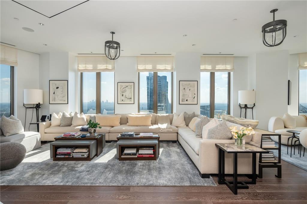 3376 Peachtree Road Northeast, Unit PH51 Atlanta, GA 30326 - Photo 12 of 43 a living room with fireplace furniture and a rug