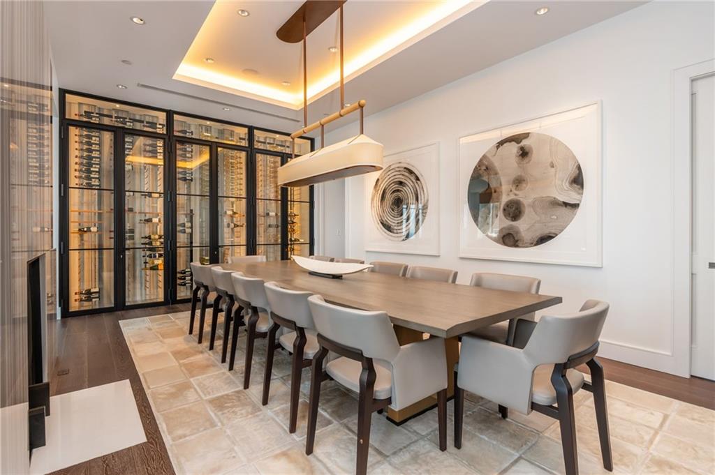 3376 Peachtree Road Northeast, Unit PH51 Atlanta, GA 30326 - Photo 13 of 43 a view of a dining room with furniture and chandelier