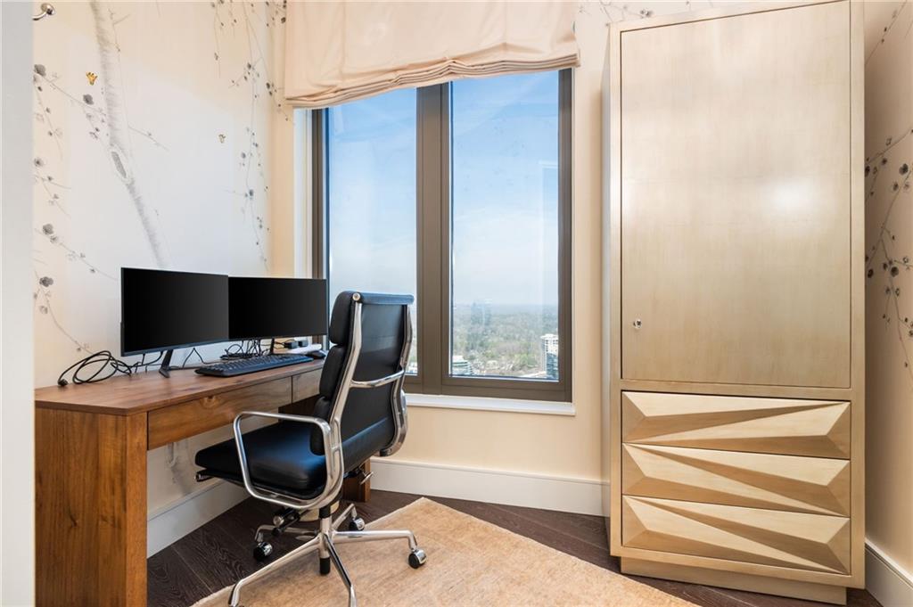 3376 Peachtree Road Northeast, Unit PH51 Atlanta, GA 30326 - Photo 27 of 43 a view of a workspace with furniture and a window
