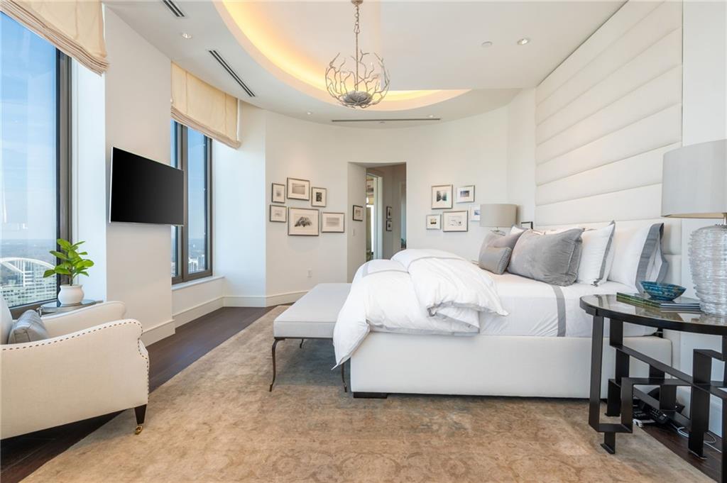 3376 Peachtree Road Northeast, Unit PH51 Atlanta, GA 30326 - Photo 30 of 43 a bedroom with a bed and a couch