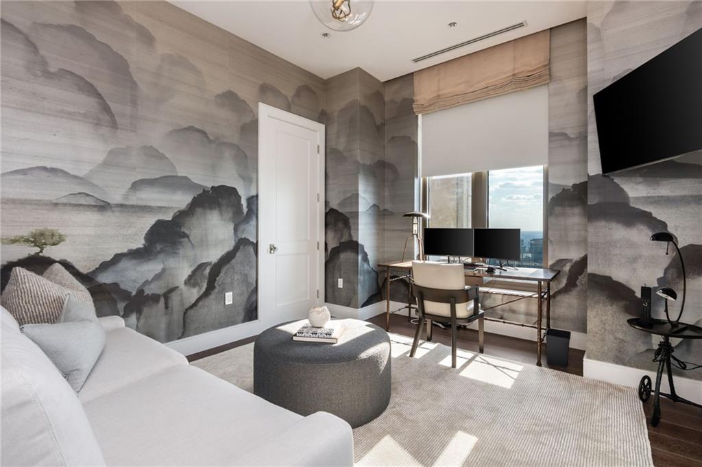 3376 Peachtree Road Northeast, Unit PH51 Atlanta, GA 30326 - Photo 36 of 43 a living room with furniture and a flat screen tv