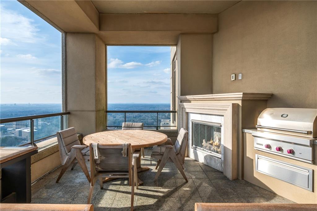 3376 Peachtree Road Northeast, Unit PH51 Atlanta, GA 30326 - Photo 38 of 43 a view of a dining room with furniture window and outside view