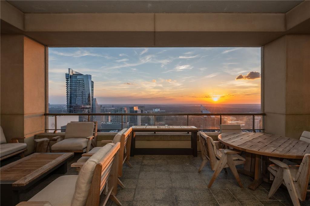 3376 Peachtree Road Northeast, Unit PH51 Atlanta, GA 30326 - Photo 39 of 43 a terrace with outdoor seating and barbeque oven