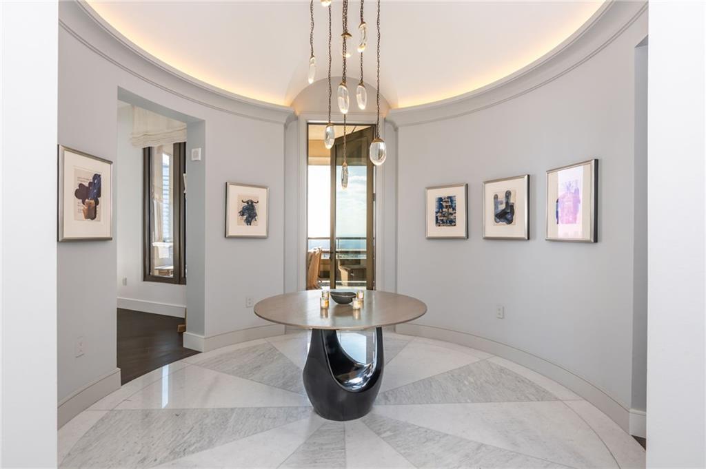 3376 Peachtree Road Northeast, Unit PH51 Atlanta, GA 30326 - Photo 4 of 43 a dining room with table chairs and window