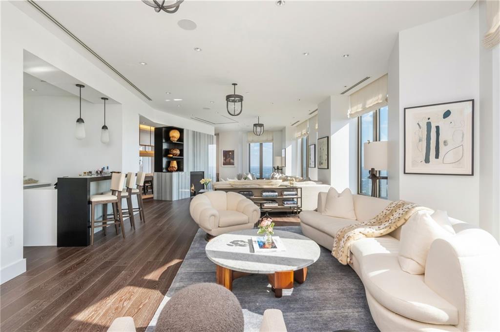 3376 Peachtree Road Northeast, Unit PH51 Atlanta, GA 30326 - Photo 5 of 43 a living room with furniture and wooden floor