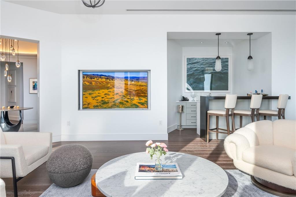 3376 Peachtree Road Northeast, Unit PH51 Atlanta, GA 30326 - Photo 6 of 43 a living room with furniture and a table