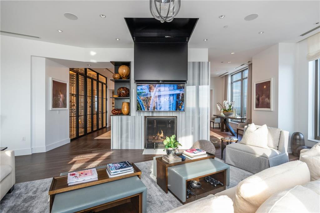 3376 Peachtree Road Northeast, Unit PH51 Atlanta, GA 30326 - Photo 9 of 43 a living room with furniture and a fireplace