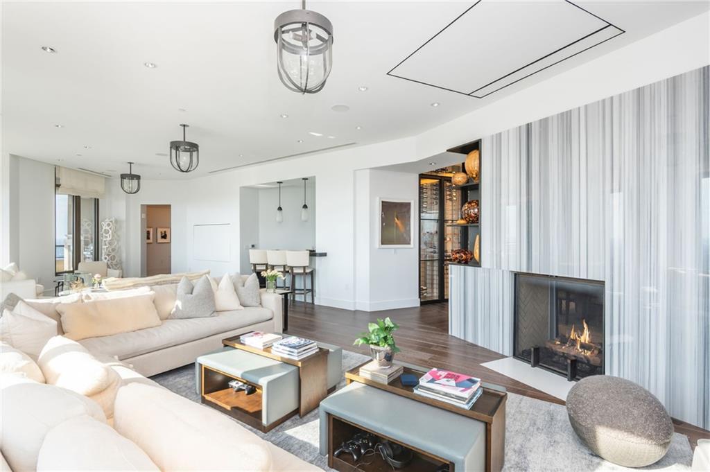 3376 Peachtree Road Northeast, Unit PH51 Atlanta, GA 30326 - Photo 10 of 43 a living room with furniture and a fireplace