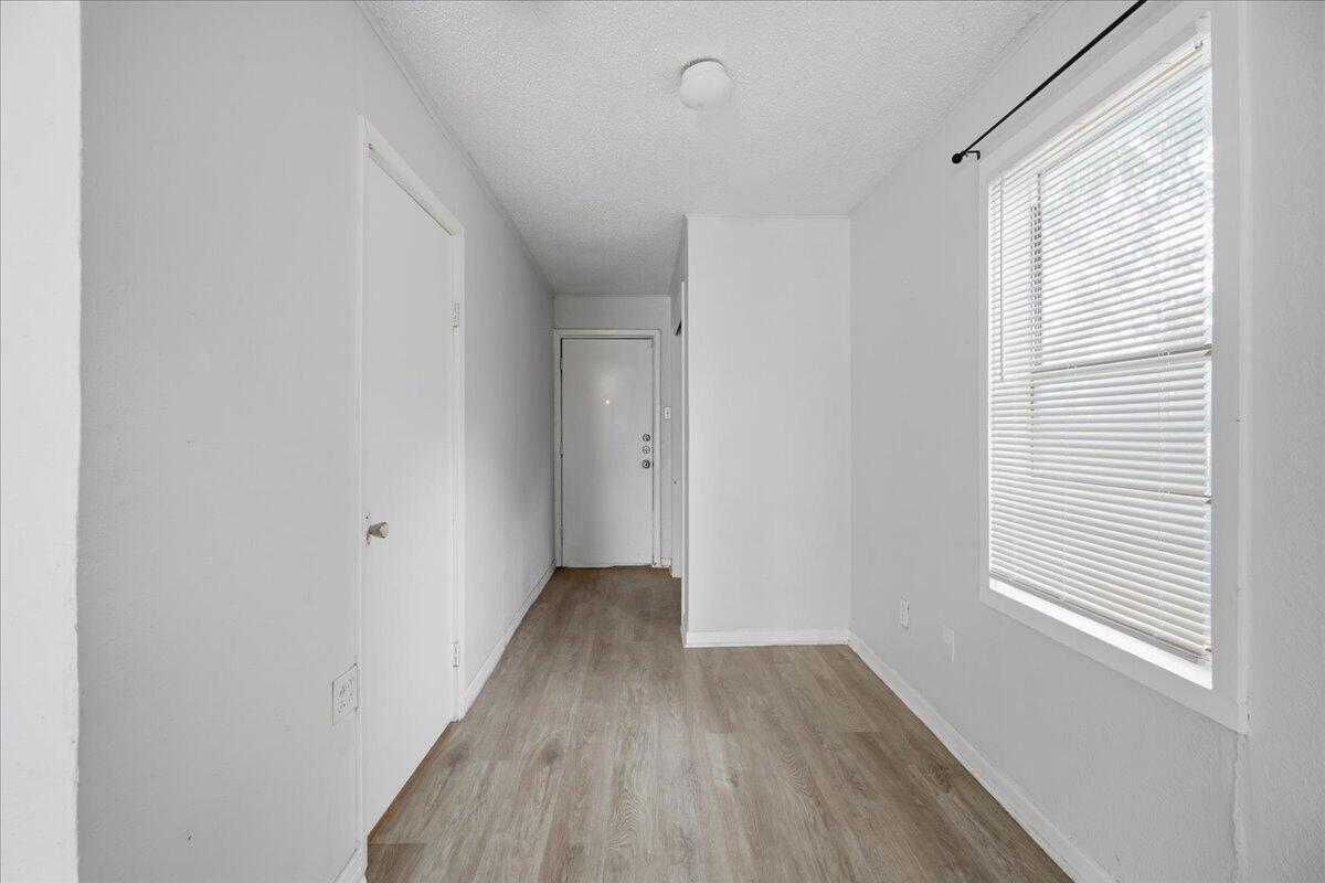 2503 30th Street Lubbock, TX 79410 - Photo 22 of 26 a view of a room with wooden floor and windows