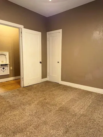 a view of an empty room and window