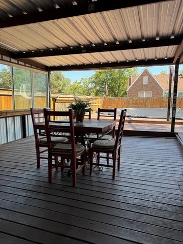 a dining space with a table and chairs