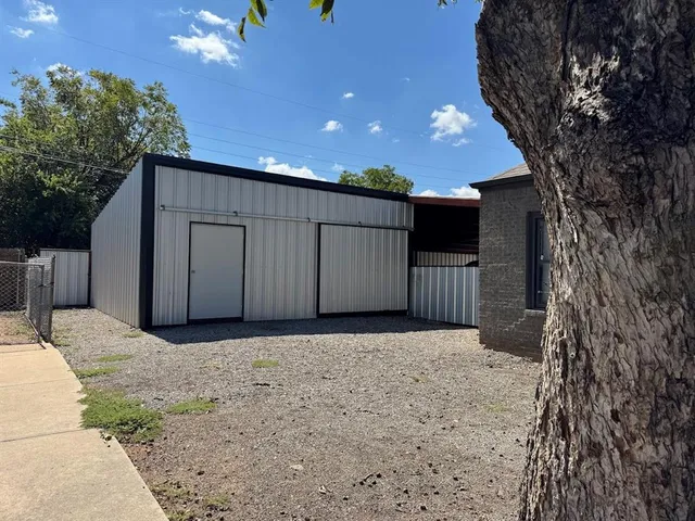 a view of a swimming pool with a patio and a yard