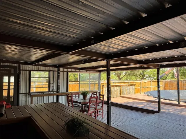 a view of workspace with wooden floor