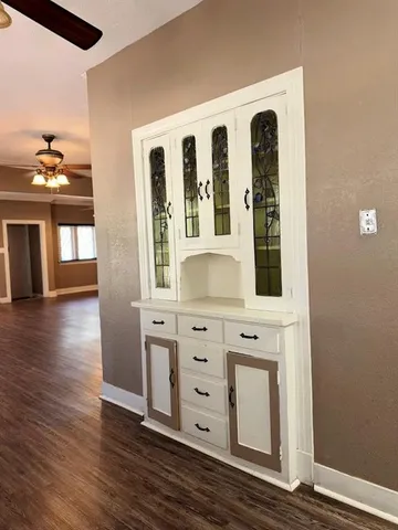 a spacious bathroom with a double vanity sink and a mirror