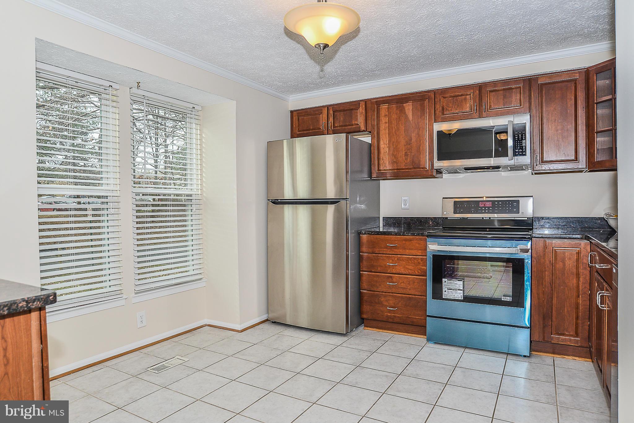 10972 Granby Court Reston, VA 20191 - Photo 4 of 30 Kitchen w/ New SS Appliances