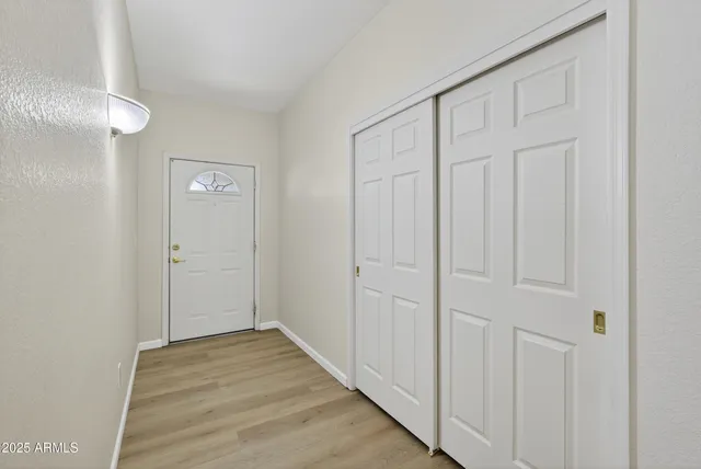a dining room with furniture and chandelier