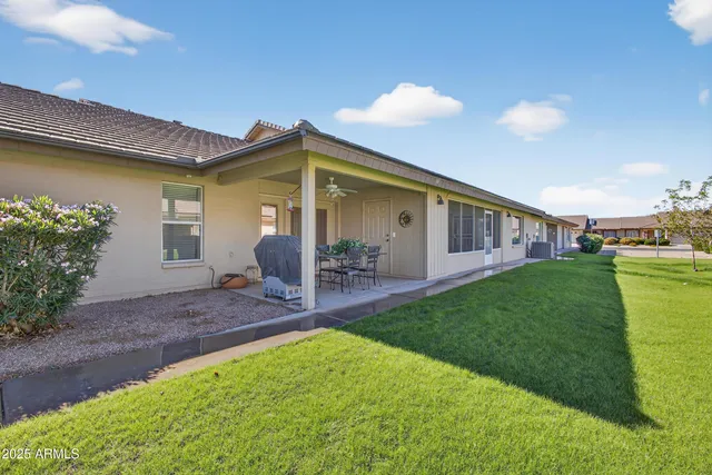 a view of a street with potted plants