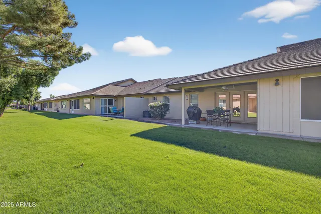 a view of a swimming pool with sitting area