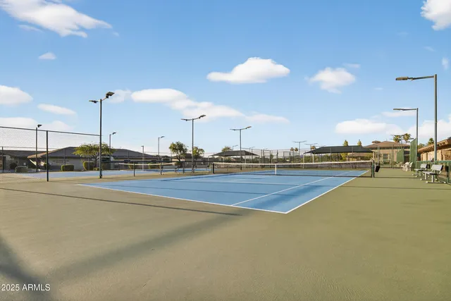 an aerial view of house with yard and ocean view