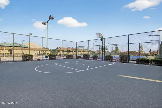 an aerial view of a house with a garden and lake view