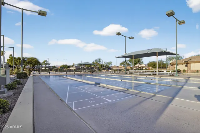 an aerial view of a house with a garden and lake view