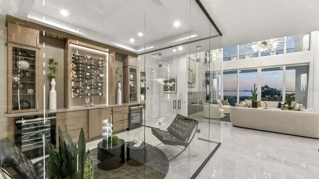 a bathroom with a granite countertop shower and a sink