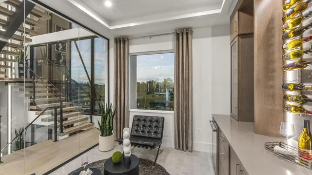 a living room with fireplace furniture and a flat screen tv