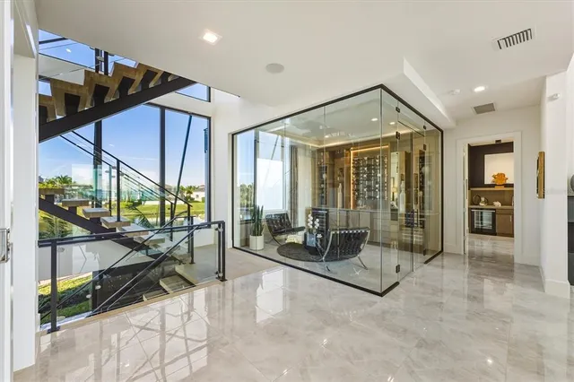 a bathroom with a granite countertop sink a toilet a mirror and shower