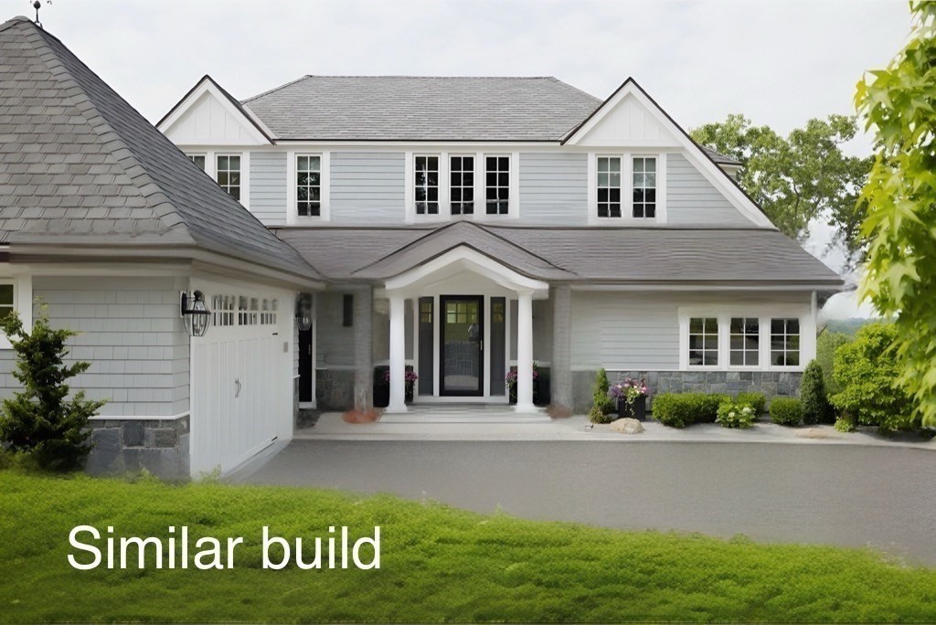 30 Buttonwood, Unit 30 Ipswich, MA 01938 - Photo 4 of 13 a front view of a house with garden
