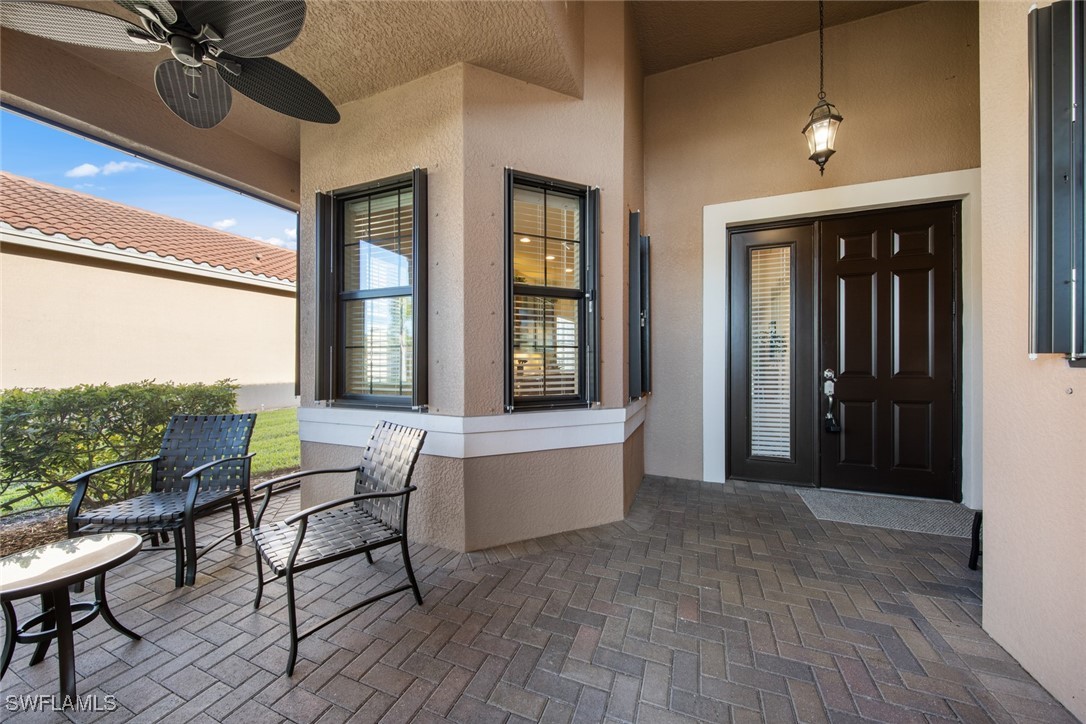 11652 Meadowrun Circle Fort Myers, FL 33913 - Photo 2 of 38 a living room with furniture and a large window