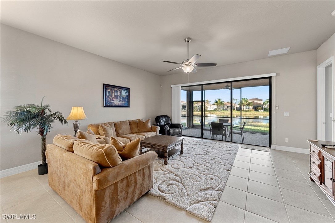11652 Meadowrun Circle Fort Myers, FL 33913 - Photo 10 of 38 a living room with furniture and a large window