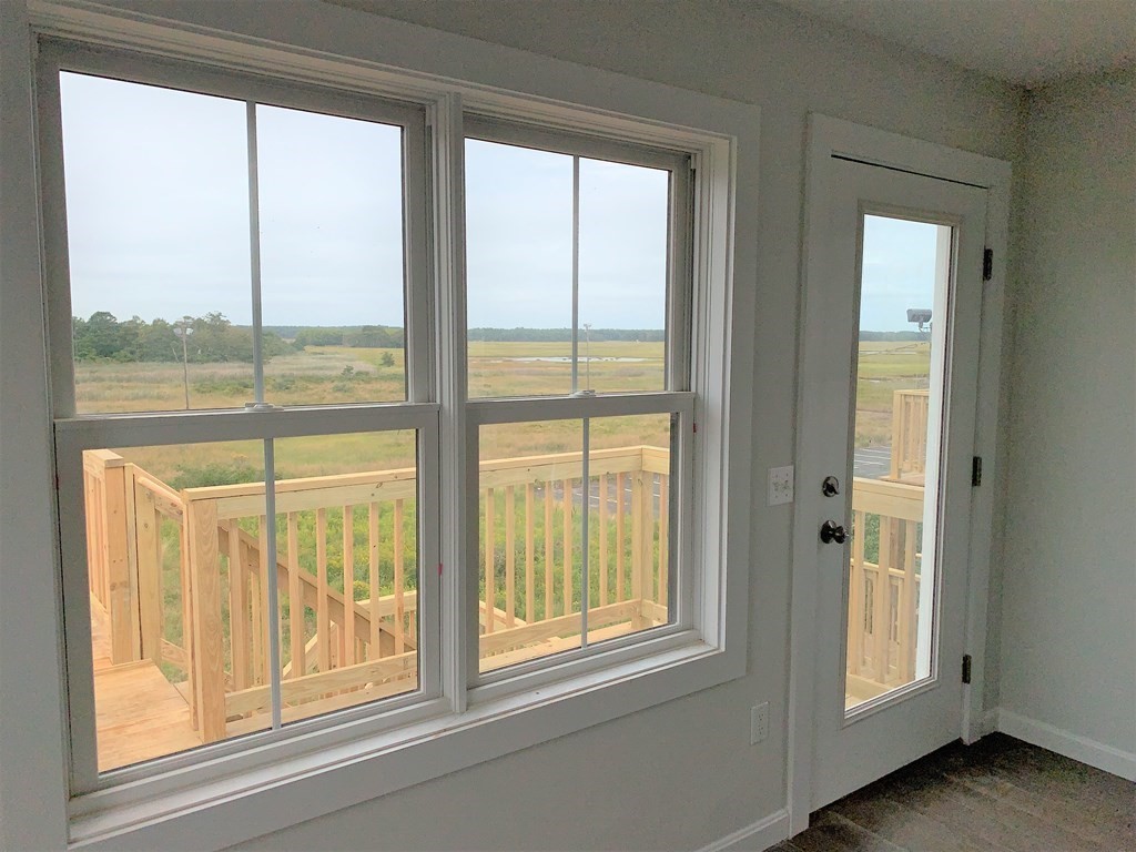 17 North End Boulevard, Unit A Salisbury, MA 01952 - Photo 4 of 13 a view of a large window with a balcony