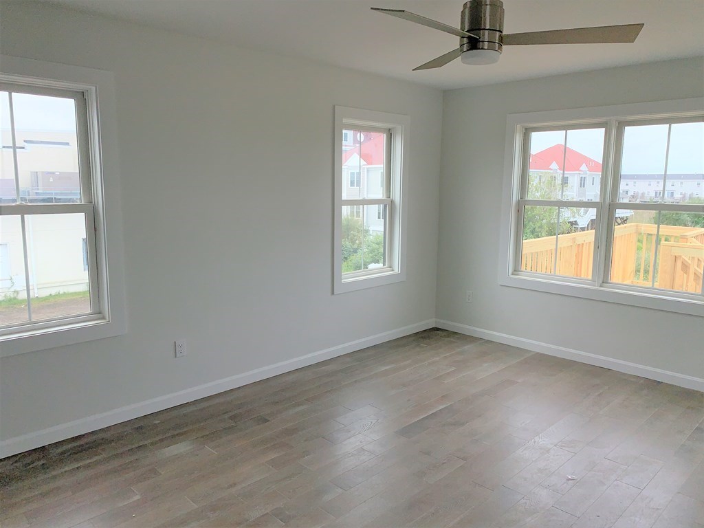 17 North End Boulevard, Unit A Salisbury, MA 01952 - Photo 4 of 13 an empty room with a window