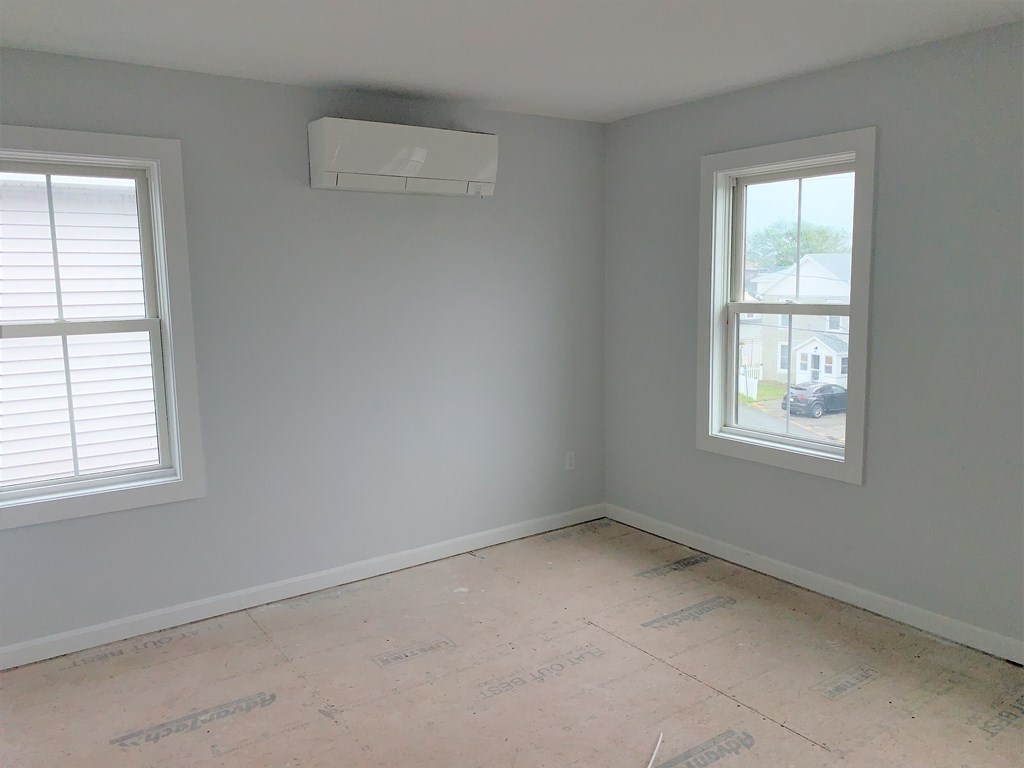 17 North End Boulevard, Unit A Salisbury, MA 01952 - Photo 7 of 13 an empty room with a window