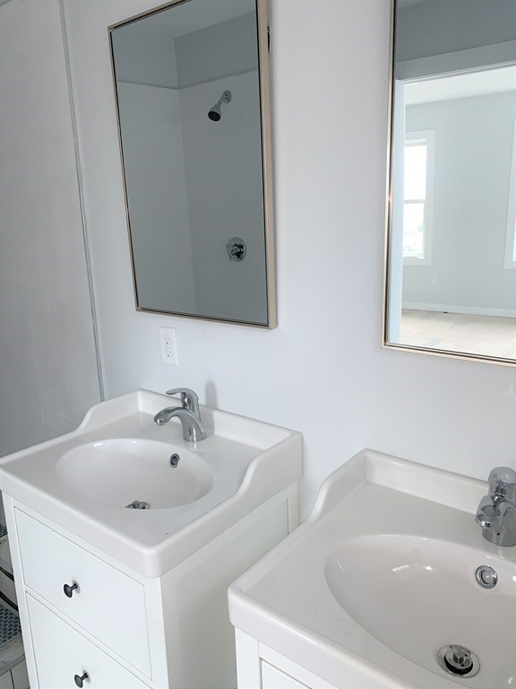 17 North End Boulevard, Unit A Salisbury, MA 01952 - Photo 8 of 13 a bathroom with a sink and a bathtub