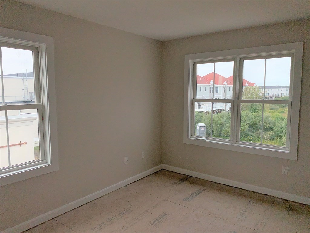 17 North End Boulevard, Unit A Salisbury, MA 01952 - Photo 10 of 13 an empty room with a window