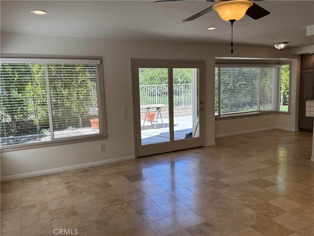 27346 Blueridge Drive Valencia, CA 91354 - Photo 15 of 44 a view of an empty room with window and chandelier