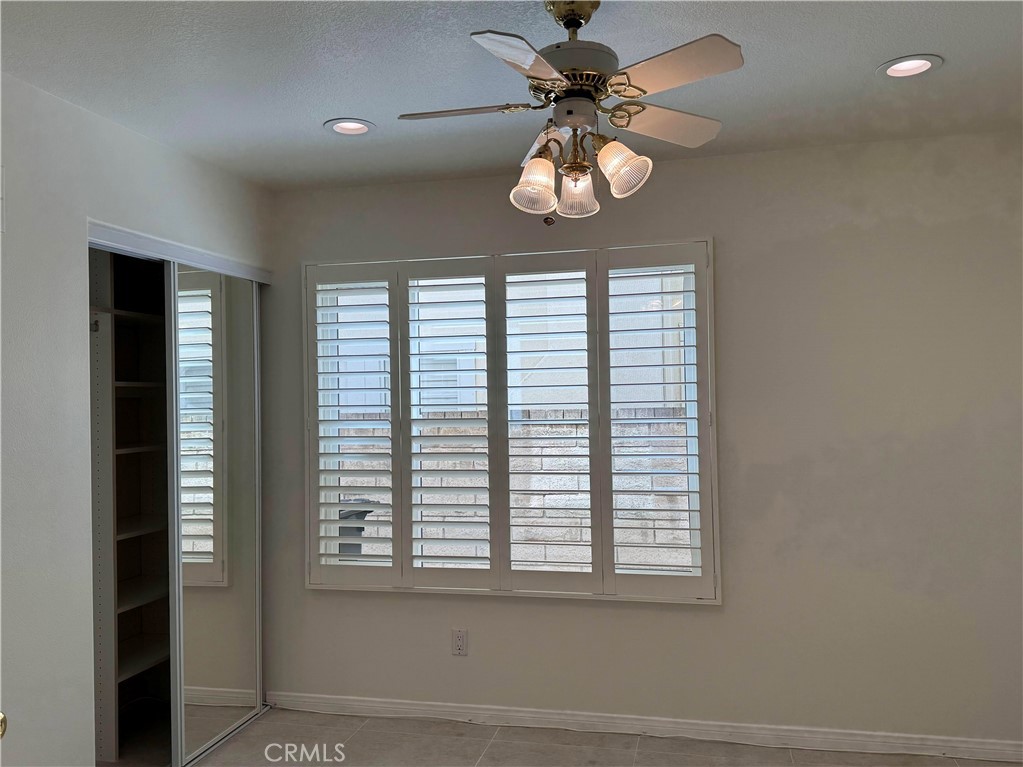27346 Blueridge Drive Valencia, CA 91354 - Photo 19 of 44 en view of a livingroom with a chandelier fan and windows