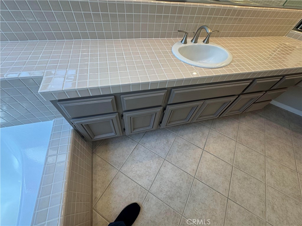 27346 Blueridge Drive Valencia, CA 91354 - Photo 35 of 44 a bathroom with a sink and a mirror