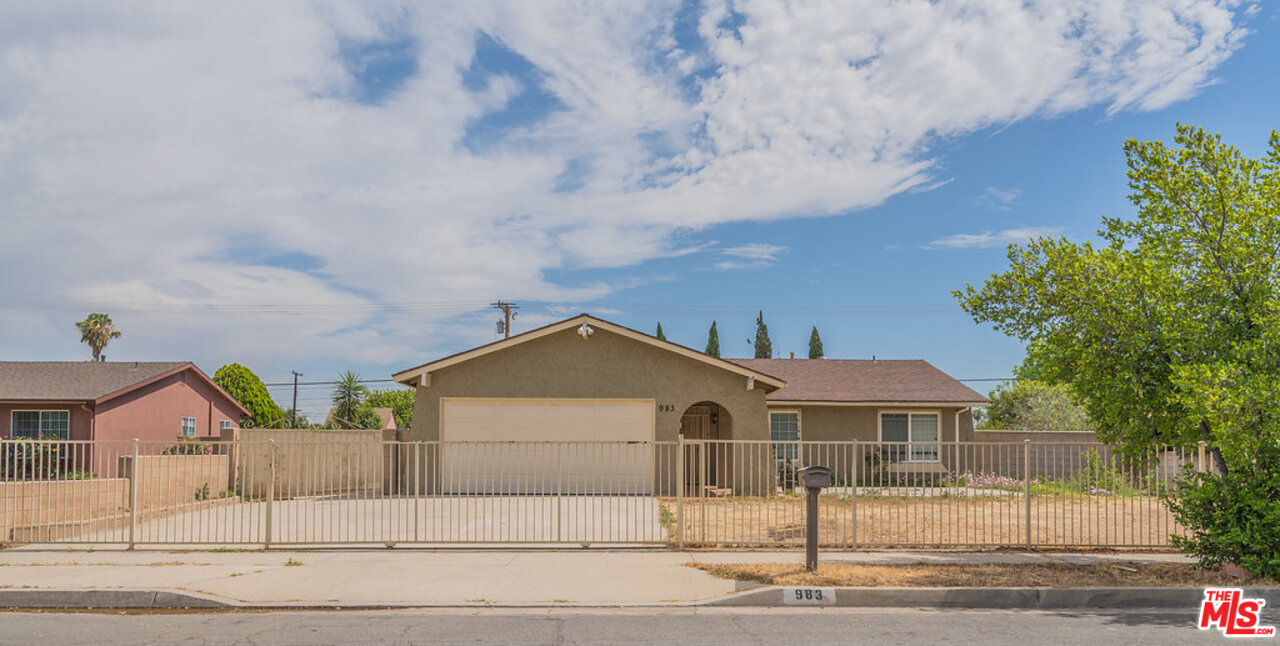 983 East Margarita Road Rialto, CA 92376 - Photo 1 of 23 front view of house with street