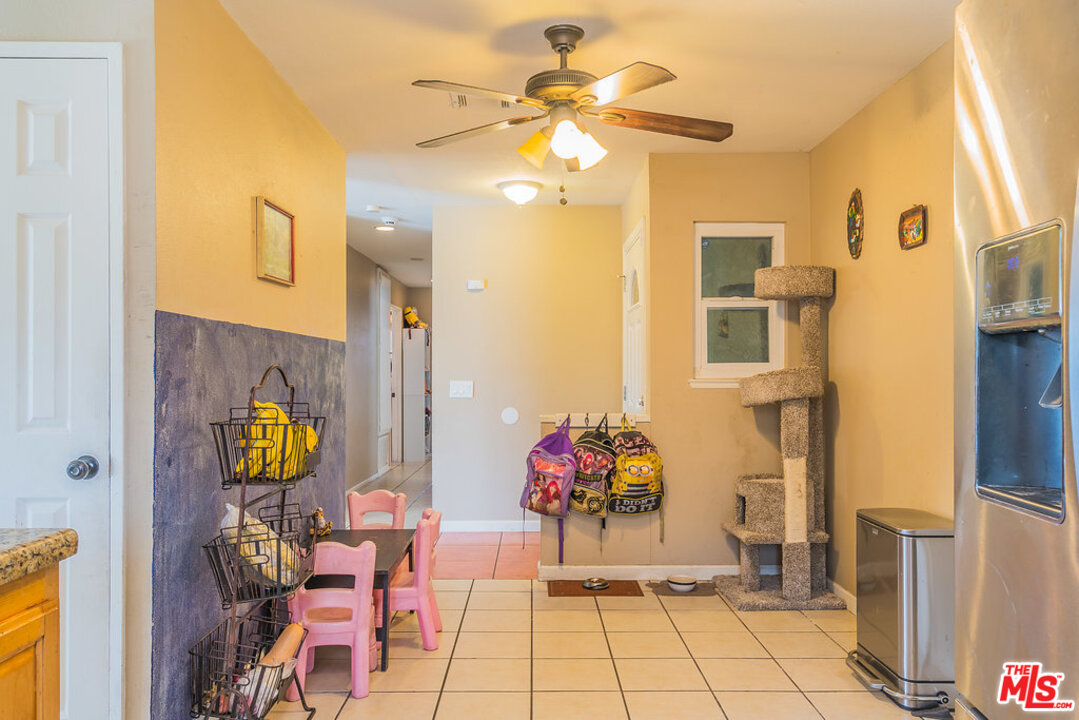 983 East Margarita Road Rialto, CA 92376 - Photo 12 of 23 a view of living room with dining area and chandelier