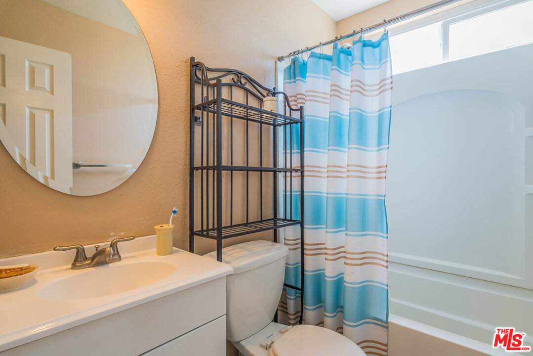 983 East Margarita Road Rialto, CA 92376 - Photo 18 of 23 a bathroom with a sink a toilet and shower